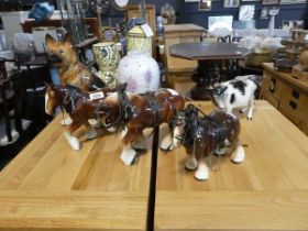 Selection of Melba ware animal ornaments to include 3 horses, a cow, together with a German shepherd
