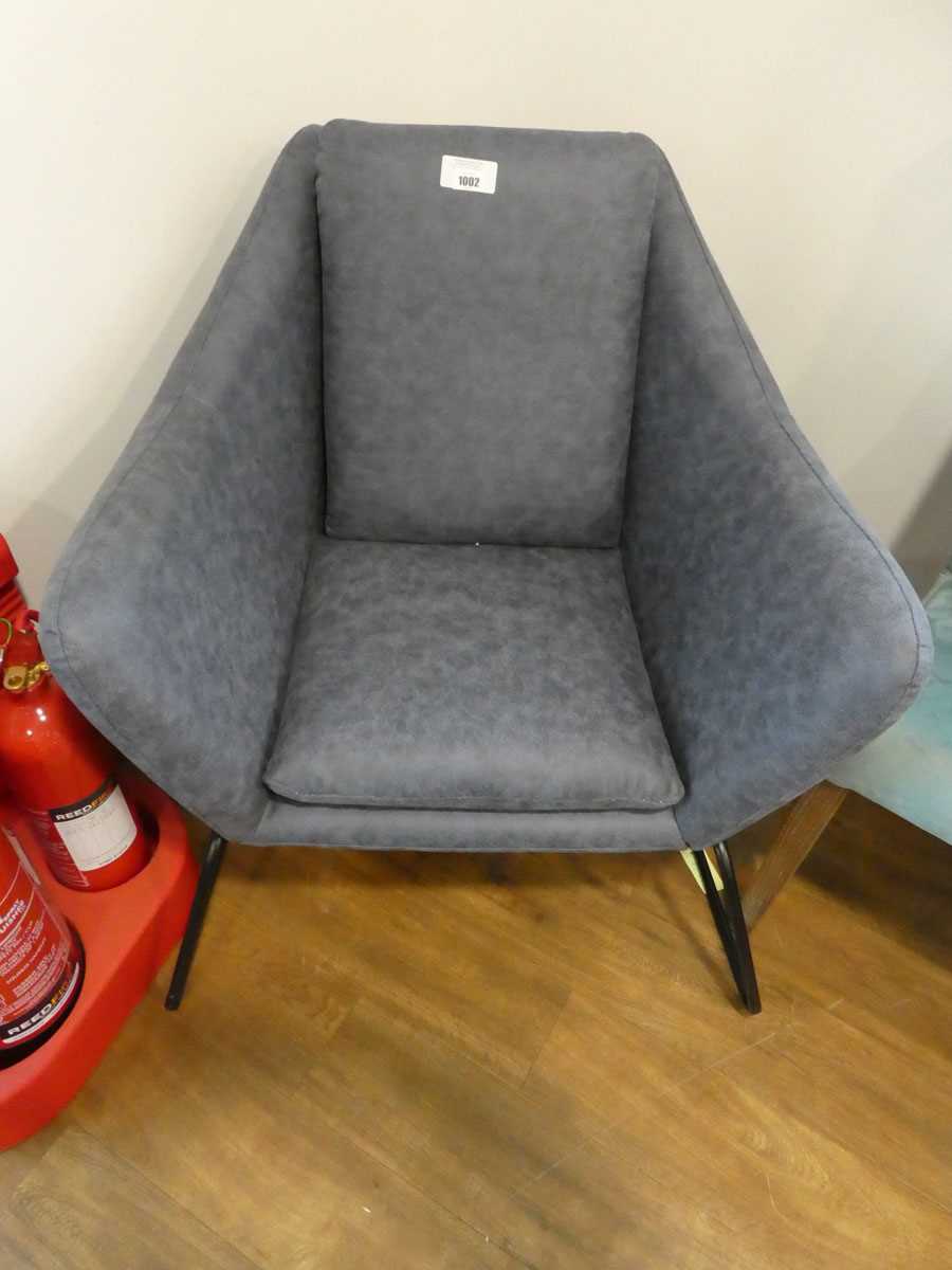 +VAT Blue leatherette upholstered easy chair on black metal supports