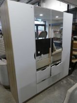 Mirrored front 4 door wardrobe with 4 single drawers below