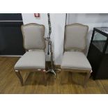 Modern pair of wooden framed natural upholstered dining chairs