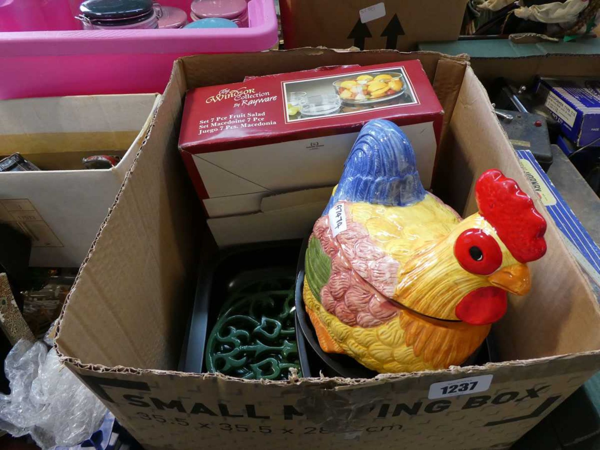 Box containing various kitchenware to include baking tins, glass serving bowls, etc