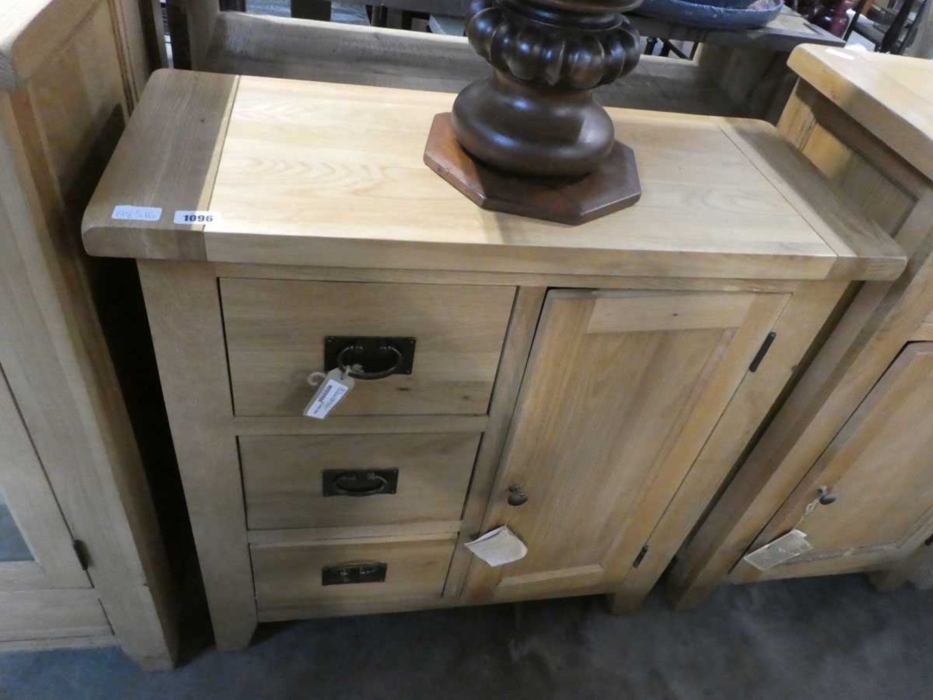 Light oak single door cupboard flanked with set of 3 drawers beside Water damaged