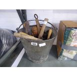 Galvanised bucket containing vintage gardening tools