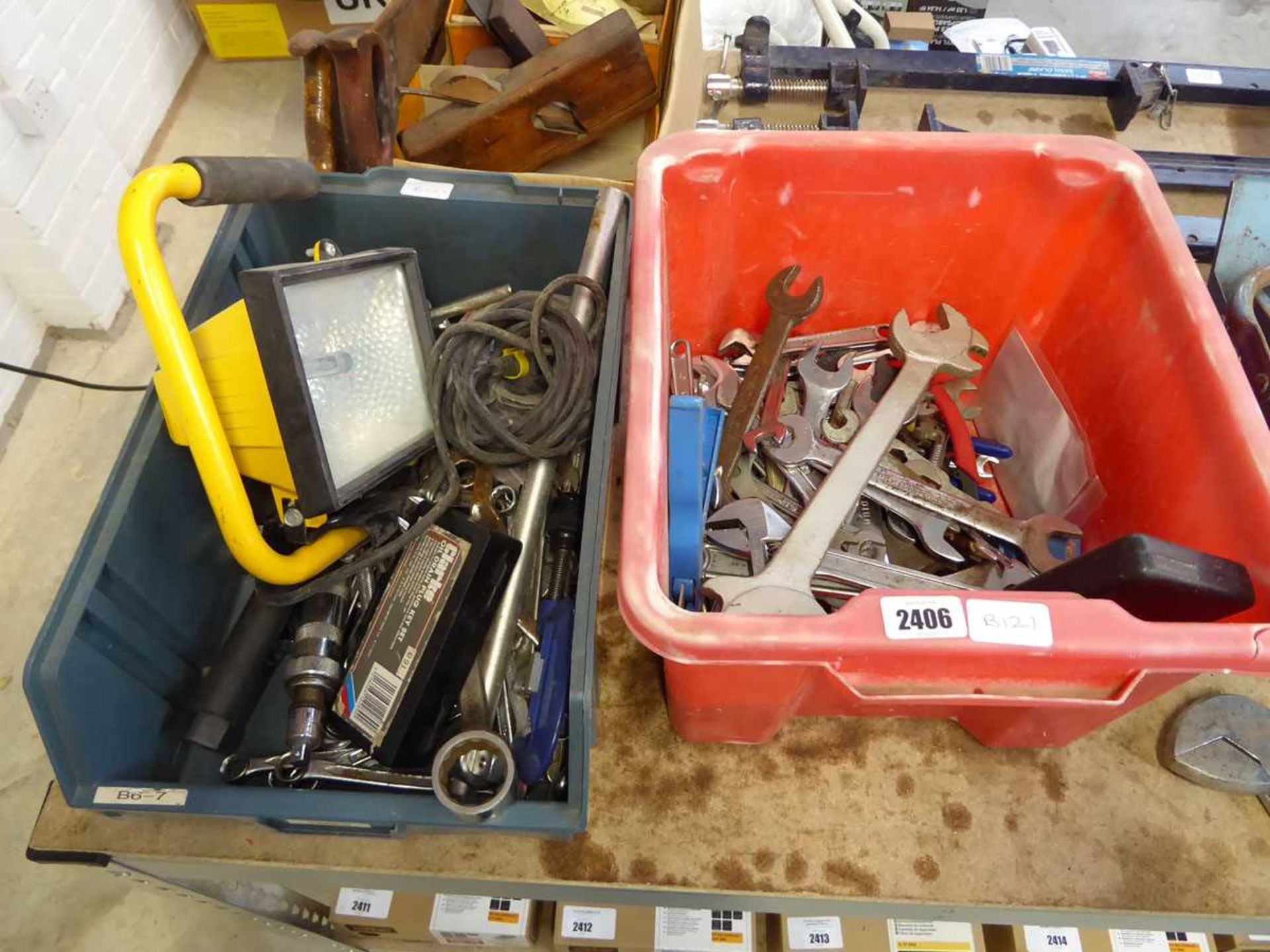 2 crates containing mixed size spanners, sockets, LED work light, etc.