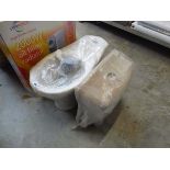 White ceramic toilet bowl and cistern