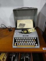 Small Imperial signet typewriter with case and pamphlet