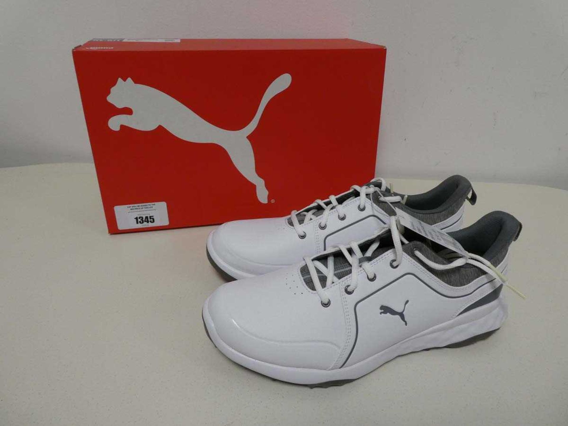 +VAT Boxed pair of men's Puma grip fusion trainers in white and grey size 9