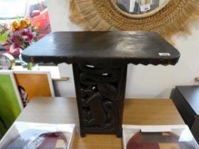 Carved wooden side table depicting various mythical creatures
