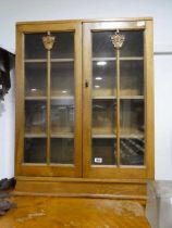 Dark oak glazed bookcase