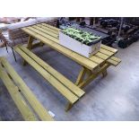 Wooden slatted picnic bench