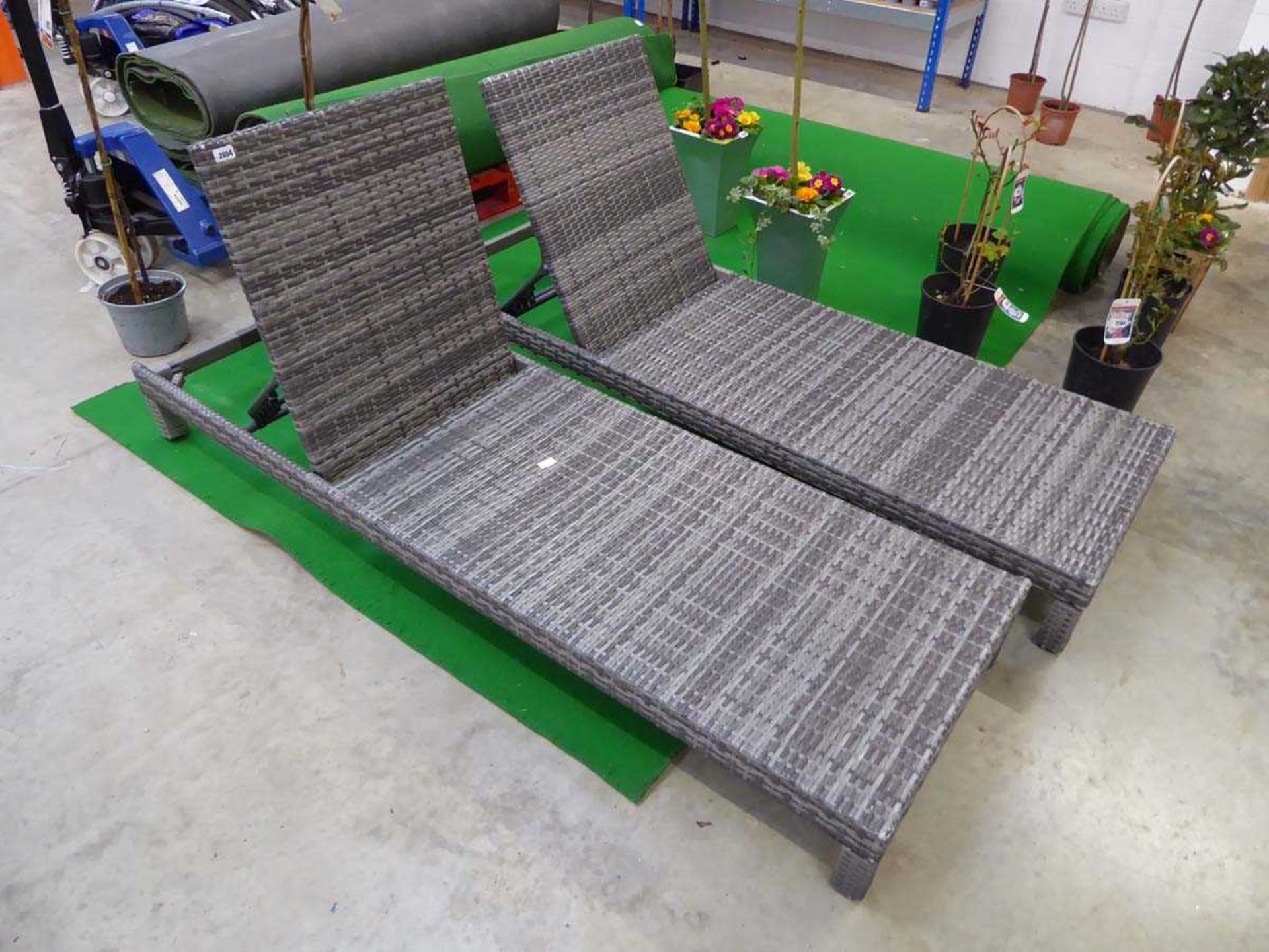 Pair of grey rattan sun loungers