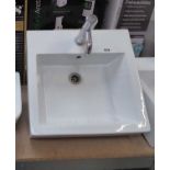 White ceramic square wall mounted basin with chrome tap