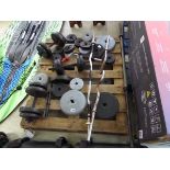 Pallet of mixed size dumbbells and weight bars