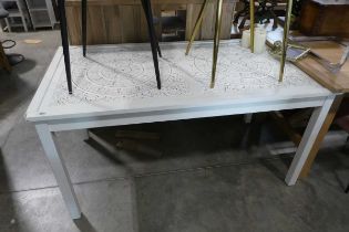 White dining table with floral embossed surface