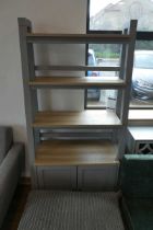 Modern grey shelving unit with double door cupboard storage to base