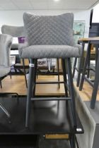 Modern grey diamond stitch upholstered bar stool on black tapered supports