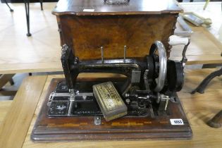 Cased manual powered vintage sewing machine with walnut inlaid case