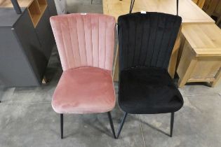 2 similar chairs on shell shaped design on black tapered supports; 1 pink, 1 black