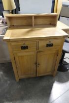 Modern light oak buffet cabinet with 2 doors, 2 drawers and gallery section over Some water damage