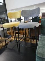 Pair of velvet upholstered bar height stools; 1 in grey, 1 in yellow