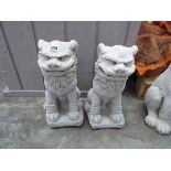 Pair of concrete kneeling Chinese lions