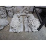 Pair of laying down concrete lions