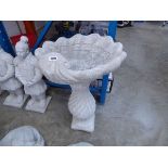 Large concrete shell shaped columned bird bath