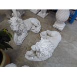 Pair of large laying down concrete lions