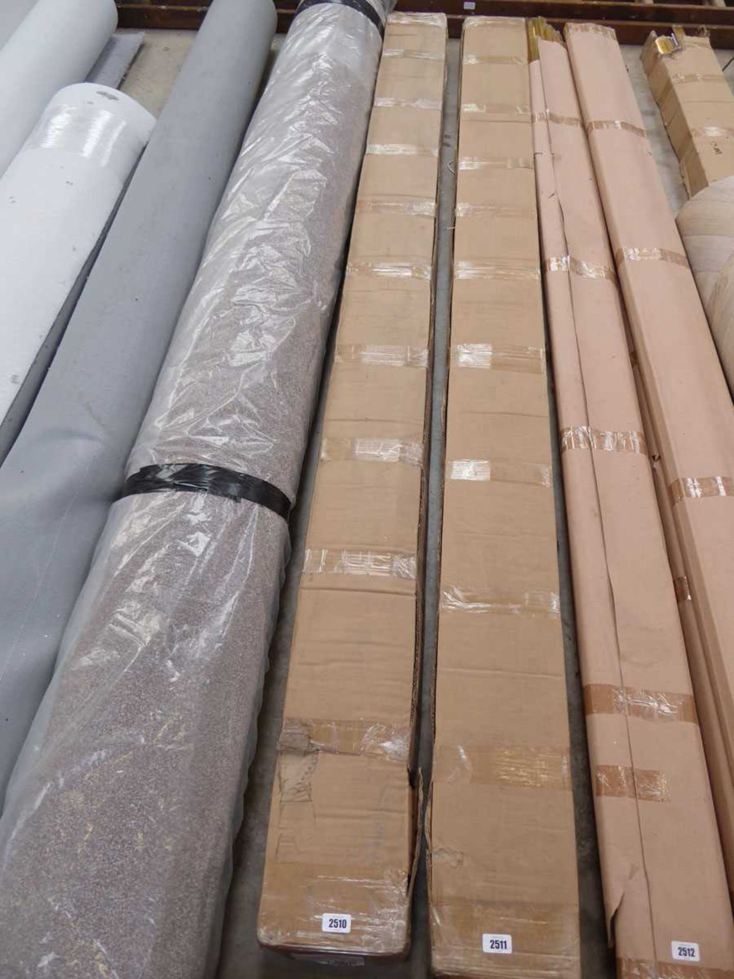 Box containing 8 packs of 15 piece bright silver coloured 2.7m carpet to door bars