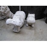 1 large and 1 smaller concrete hippo