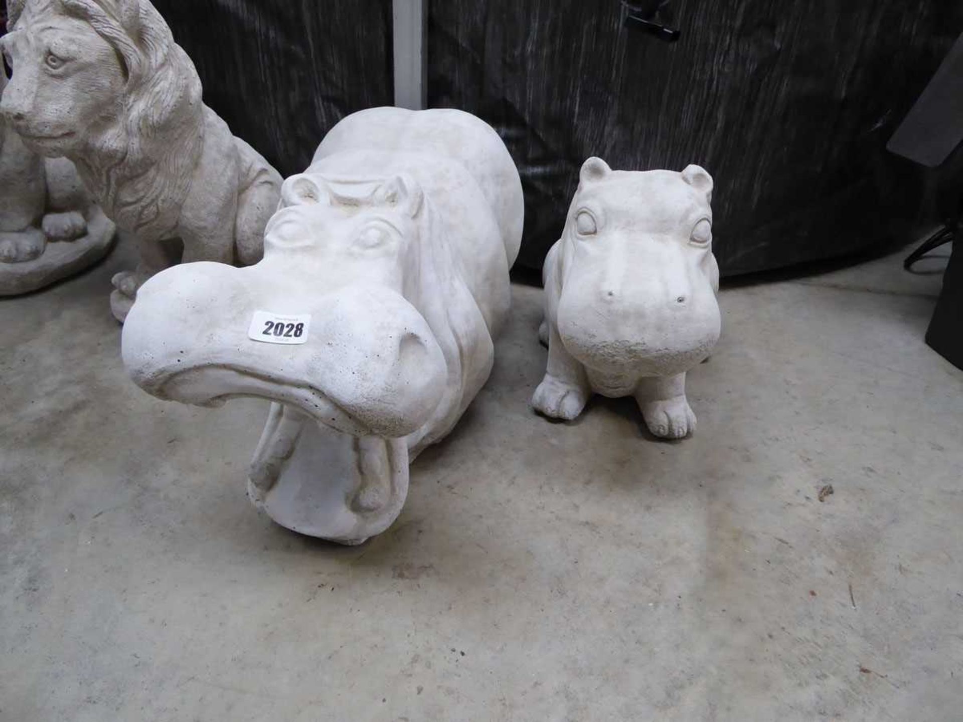 1 large and 1 smaller concrete hippo