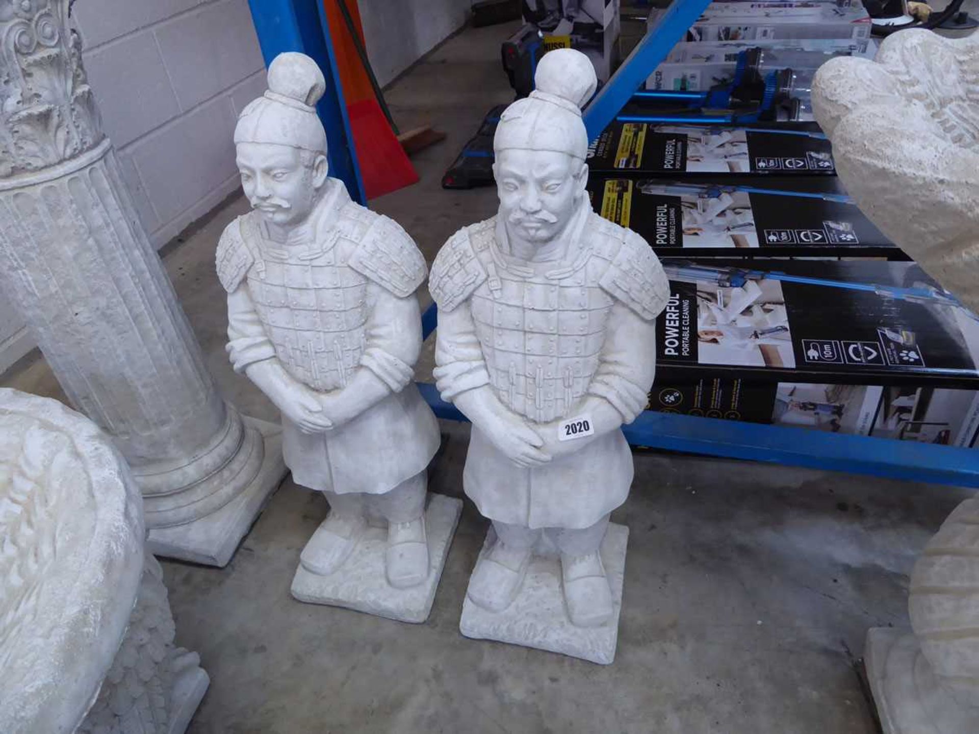 Pair of concrete Chinese warriors