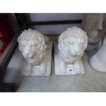 Pair of laying down concrete lions