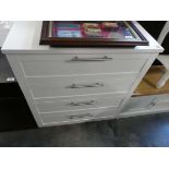 Modern white chest of 4 drawers with chrome bar handles