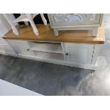 Modern white entertainment unit with light oak surface