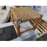 Small wooden stool with a rush seat