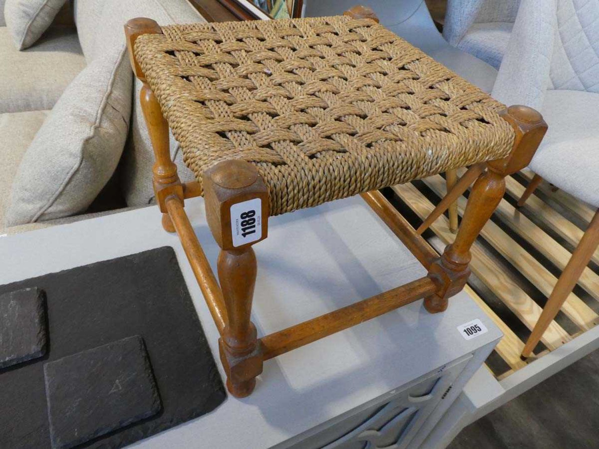 Small wooden stool with a rush seat