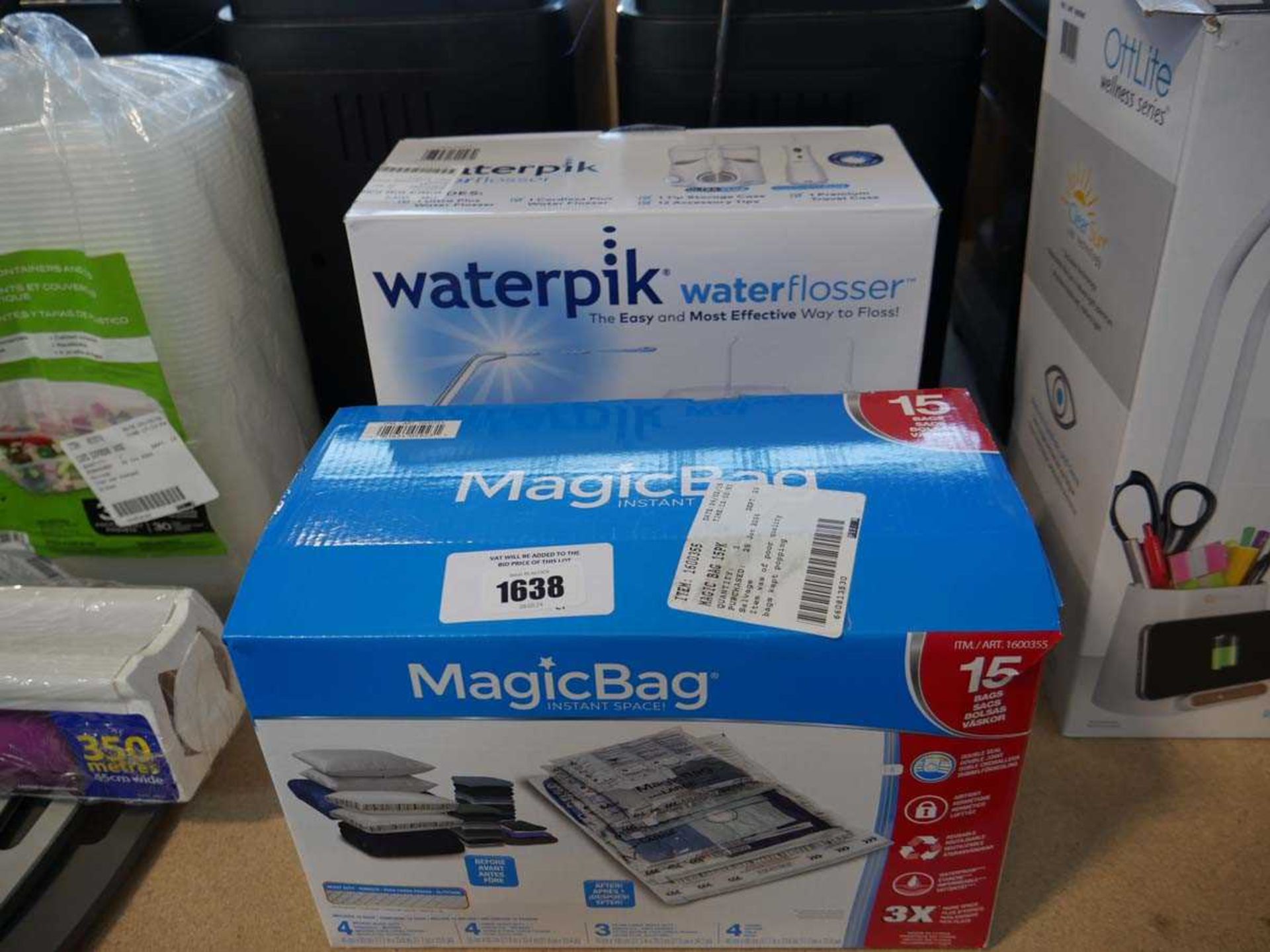 +VAT WaterPik water flosser with Magic Bag instant space saver pack