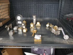 Cage containing various miniature clocks in various forms, to include bike, guitar, post box,