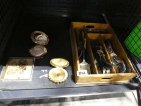 Cage containing various powder compacts, yellow metal jewellery and a tray of white metal cutlery
