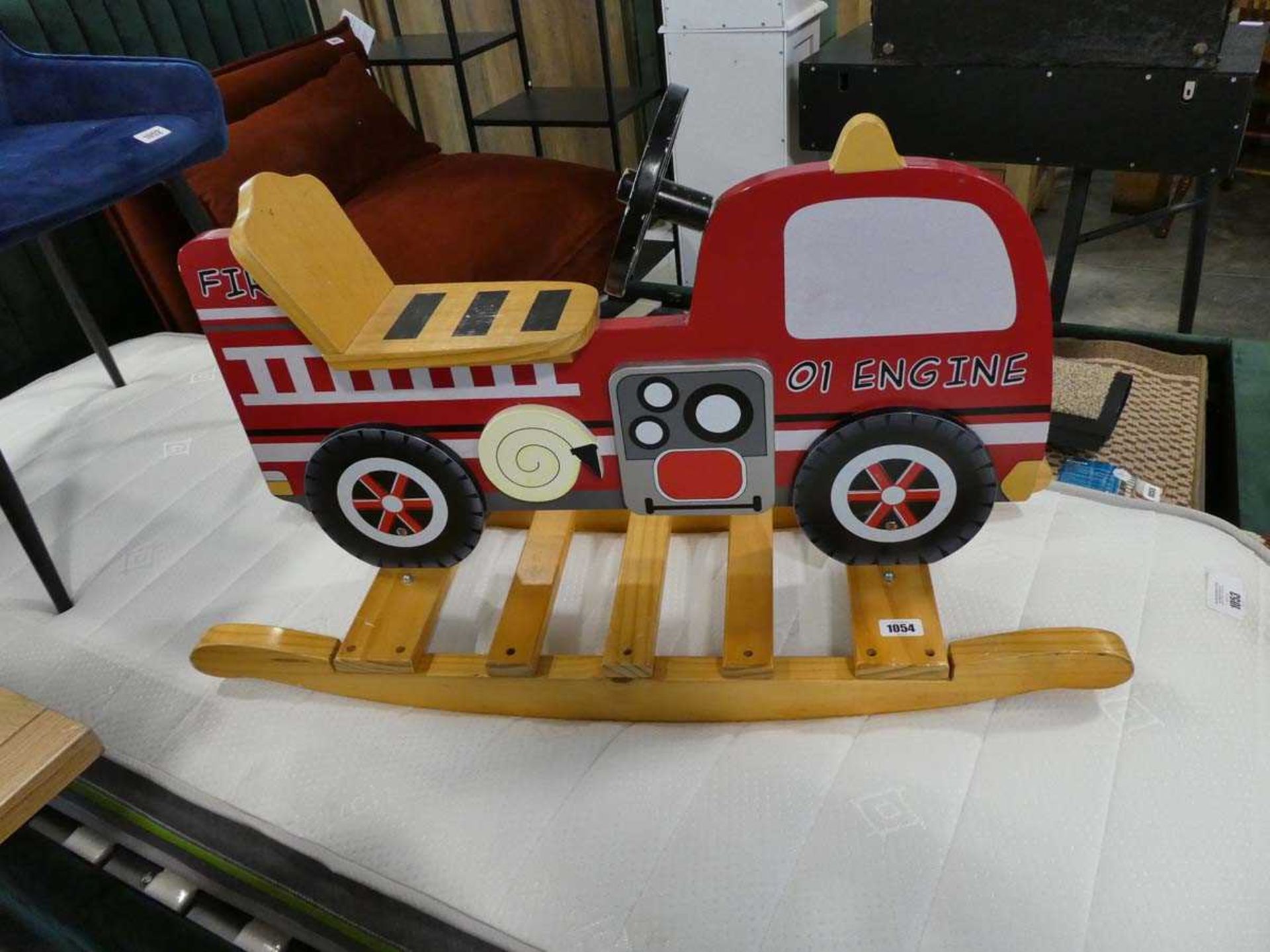 Fire engine shaped rocking toy