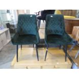 2 dark green velvet effect upholstered chairs on black tapered supports
