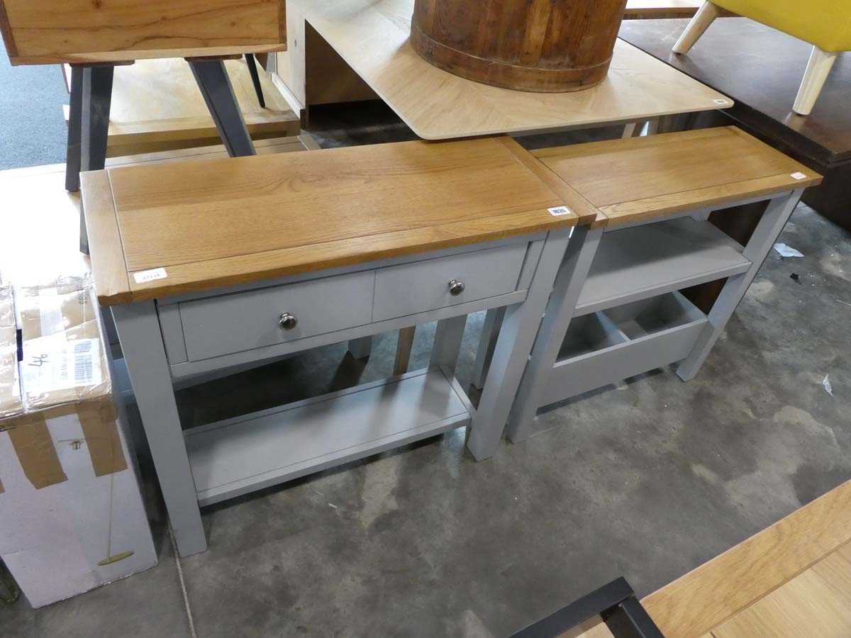 Modern grey single drawer side table with light oak surface. together with a similar shelving unit