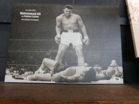 2 canvas art prints; 1 depicting Muhammad Ali versus Sonny Liston and the other featuring Chorus