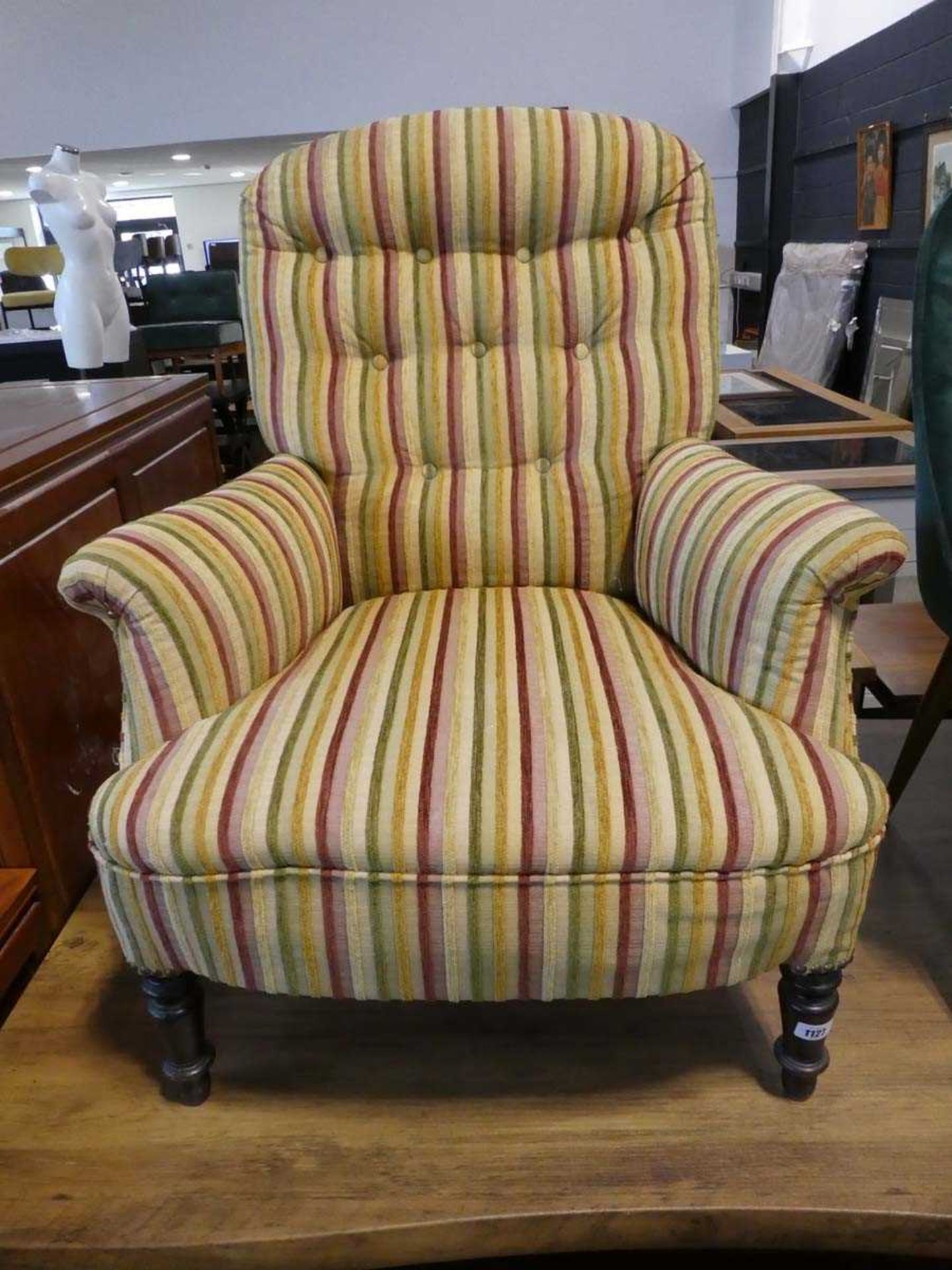 Striped upholstered button back easy chair