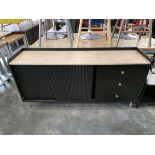 Modern black sideboard with ribbed sliding doors and 3 drawers