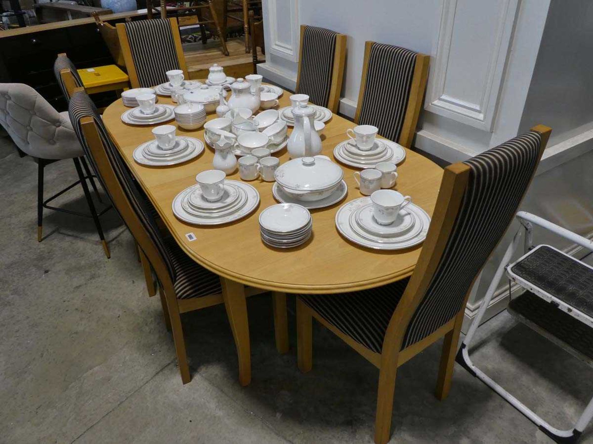 Modern beech finish extending dining table with 6 matching striped high back upholstered dining