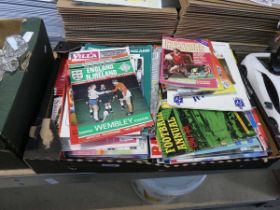 Crate containing various football programmes