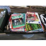 Crate containing various football programmes