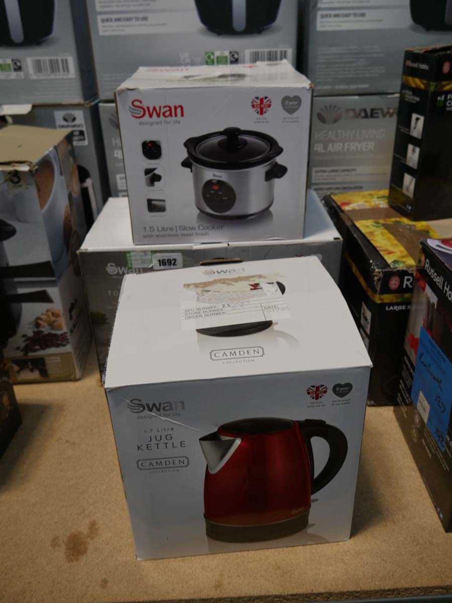 Swan 1.7L jug kettle together with a Swan 2 slice toaster and a Swan 1.5L slow cooker